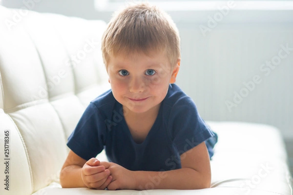 Fototapeta Portrait of happy smiling boy. Attractive kid at home.