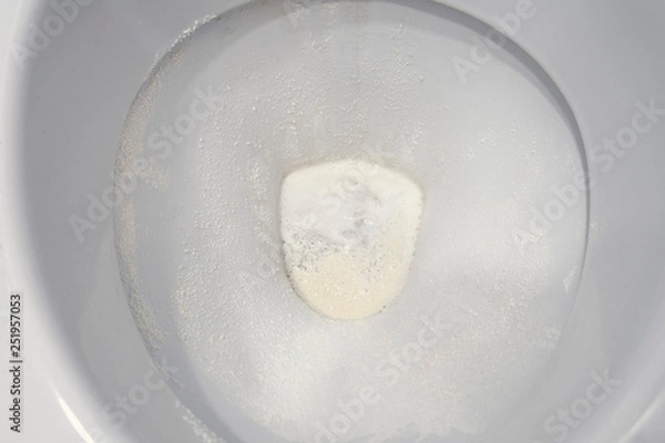 Obraz Toilet bowl sprinkled with detergent powder, close-up