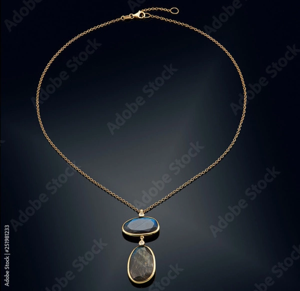 Fototapeta Golden necklace with isolated on black