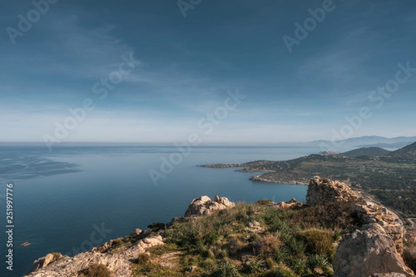 Fototapeta Coast of Corsica viewed from rocky mountain outcrop