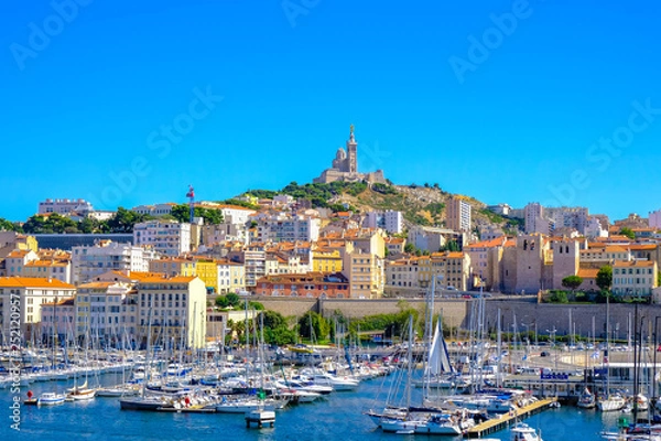Fototapeta MARSEILLE, FRANCE - AUGUST 11, 2018 - Marseille embankment with yachts and boats in the Old Port and Notre Dame de la Garde. Vieux-Port de Marseille.