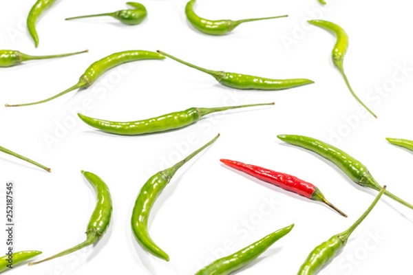 Fototapeta Fresh green and red chili pepper is a frame pattern isolated on white background.