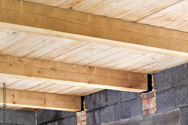Fototapeta Construction details - framing installing the roof truss system