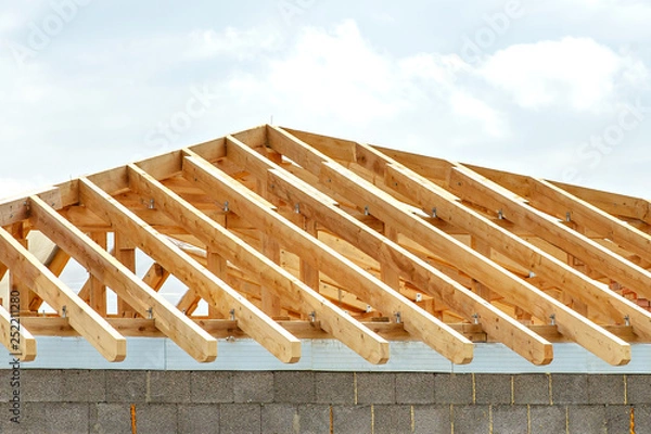 Fototapeta Construction details - framing installing the roof truss system