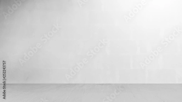 Fototapeta Cement wall with floor in the empty room and light for background.