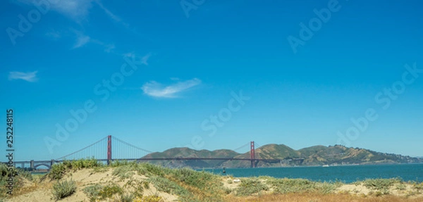 Fototapeta Golden Gate Bridge from the beach, sunny day with blue sky