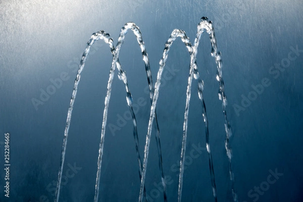 Obraz Four water jets from a fountain. Abstract image.