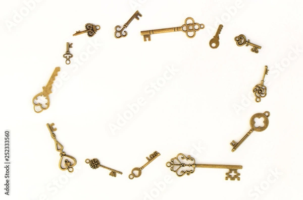 Fototapeta Decorative keys of different sizes, stylized antique on a white background. Arranged in a circle