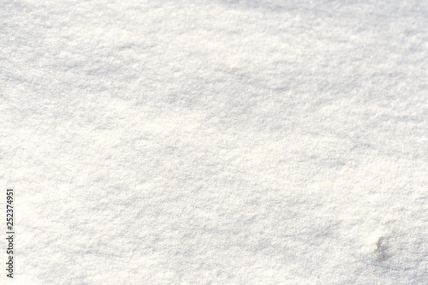 Fototapeta The texture of the snow close up. WInter background