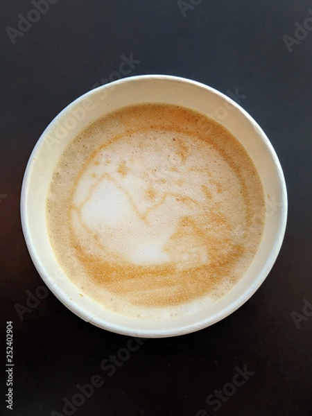 Fototapeta cup of coffee with a print on foam