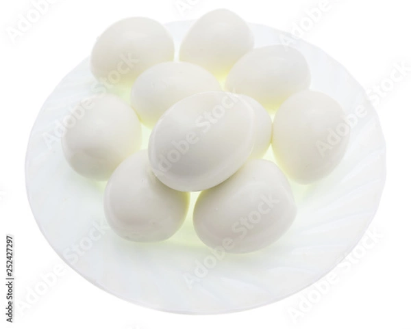 Fototapeta Peeled boiled eggs in a plate on a white background