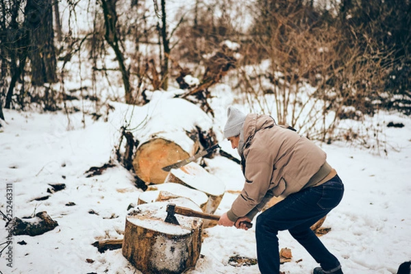 Fototapeta Senior man working in a personal lumber yard