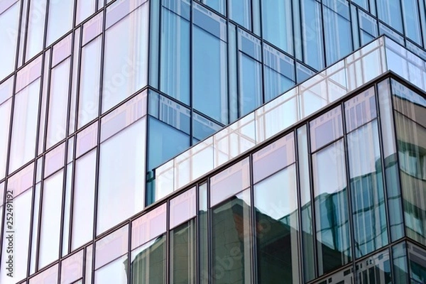 Fototapeta The windows of a modern building for offices. Business buildings architecture.