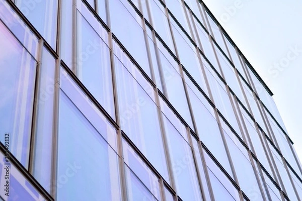 Fototapeta The windows of a modern building for offices. Business buildings architecture.
