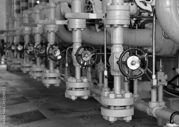 Fototapeta Valves manual in the production process. Production process used manual valve to control the system, Operator open and close or function the valve for controlled pressure or gas and oil flow rate.