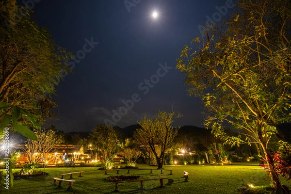 Obraz circle bench under a lamp and moon in the park at night