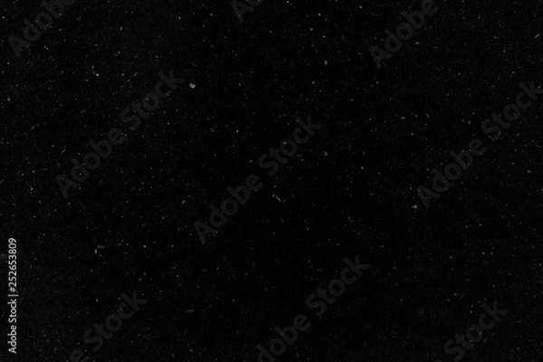Fototapeta Dark texture with white noise from dust and small fragments