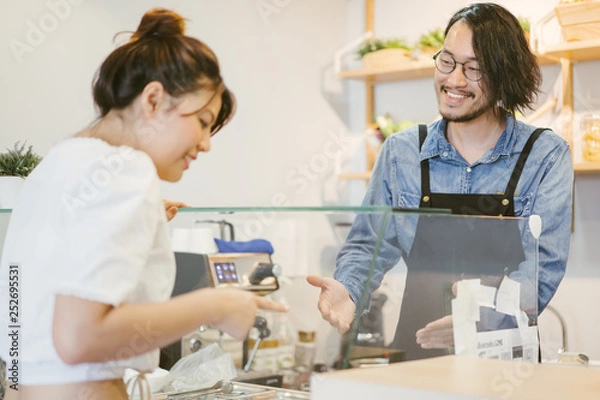 Obraz customer select and choose some food order to waiter at bar