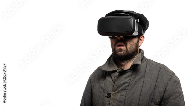 Obraz Old fashioned man develops virtual reality headset, on white background, studio shot. Comical style
