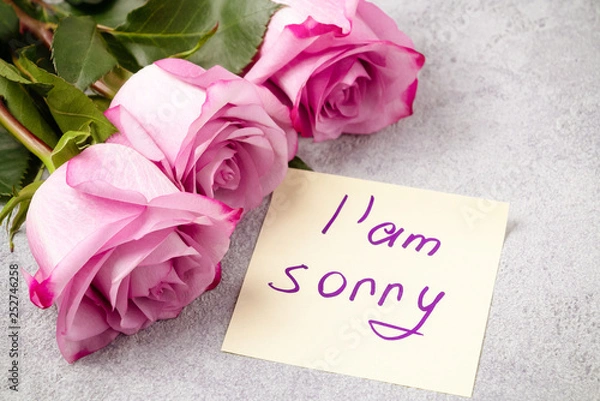 Fototapeta bouquet of pink roses, a heart and a note with the inscription I love you on the table-the concept of love and care