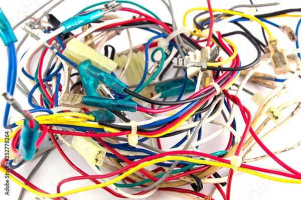 Fototapeta a bunch of intertwined multicolored wires on a white close-up