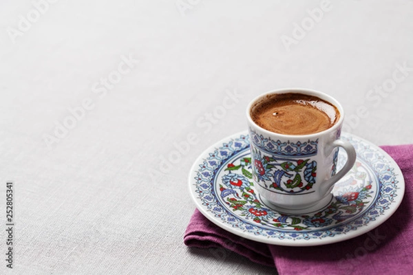 Fototapeta Black coffee in traditional Turkish cup