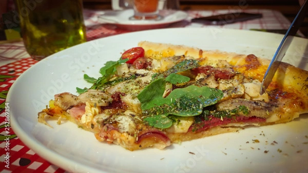 Fototapeta  Close up of eating Slice of pizza in cafe 