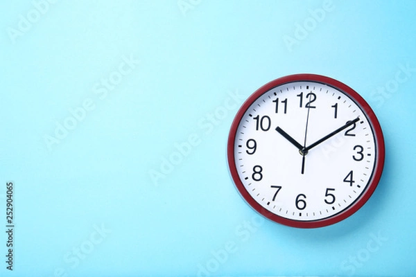 Fototapeta Round clock on blue background