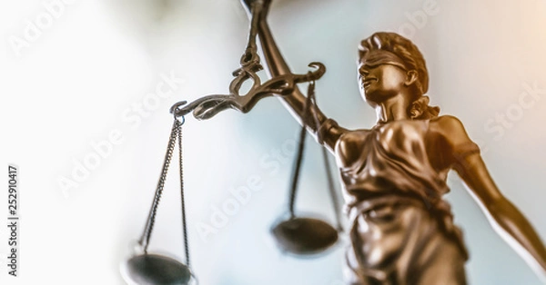 Fototapeta Statue of lady justice on bright background - Side view with copy space.