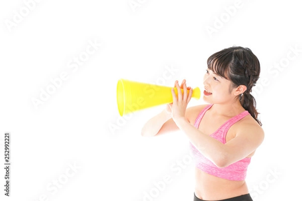 Fototapeta スポーツウェアで応援する若い女性