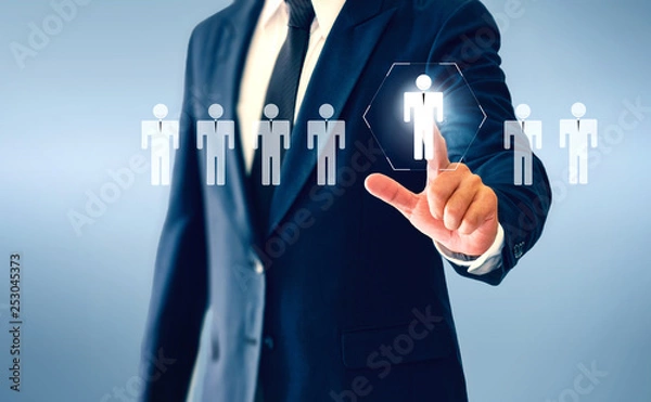 Obraz Businessman touching person virtual button about the concept of recruiting person and Personal development.