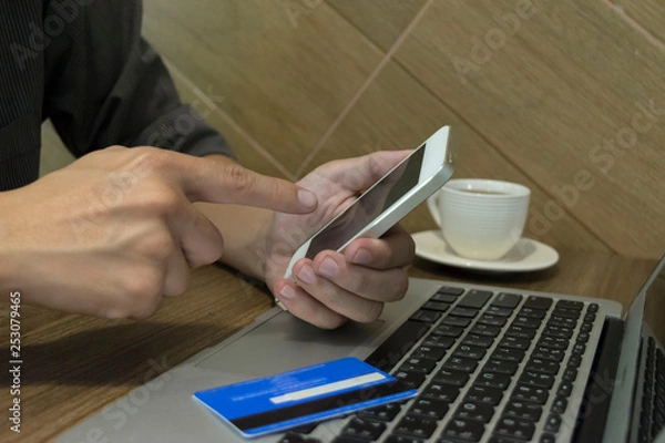 Obraz Young women are playing computers and buying products on the internet. Today is the full Internet era.