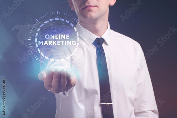 Fototapeta The concept of business, technology, the Internet and the network. A young entrepreneur working on a virtual screen of the future and sees the inscription: Online marketing