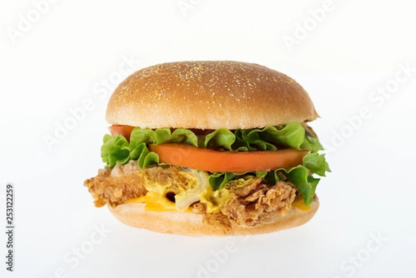 Fototapeta delicious unhealthy chicken burger isolated on white