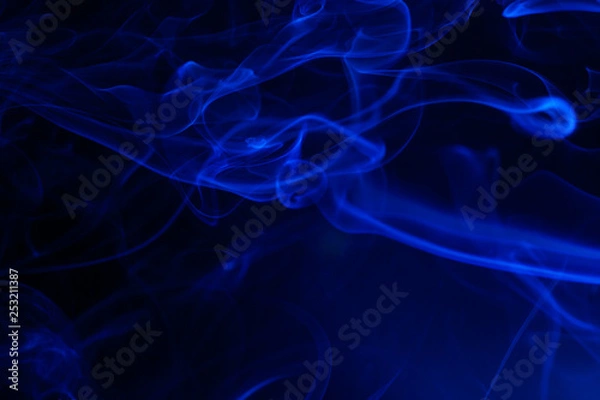 Obraz Blue smoke on black background.