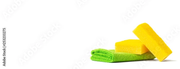 Obraz Yellow dish sponges and a green microfiber towel. Isolated on white background. Copy space.