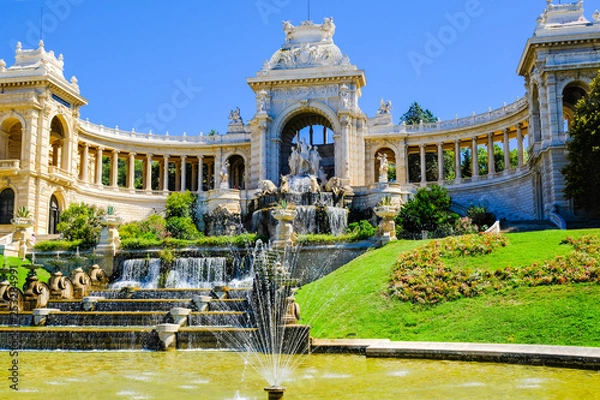 Fototapeta Marseille. Palais de Longchamp with fountains and sculptures in sunny day, view from the right side.