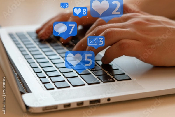 Fototapeta Man is using laptop with black keys, Social media and social networking. Marketing concept