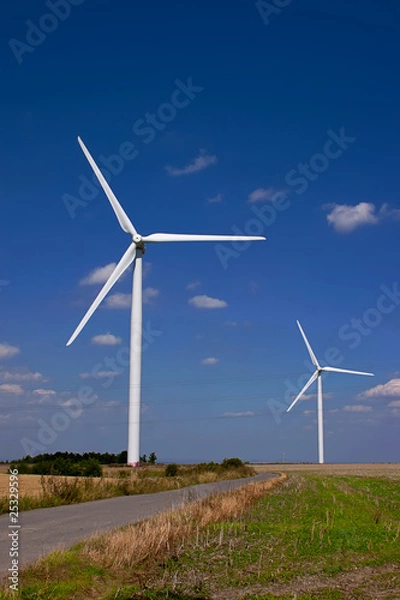 Fototapeta Road between wind power towers