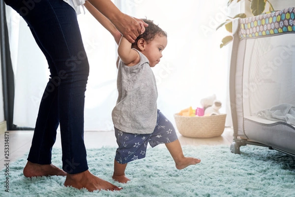 Obraz Mixed race baby learning to walk