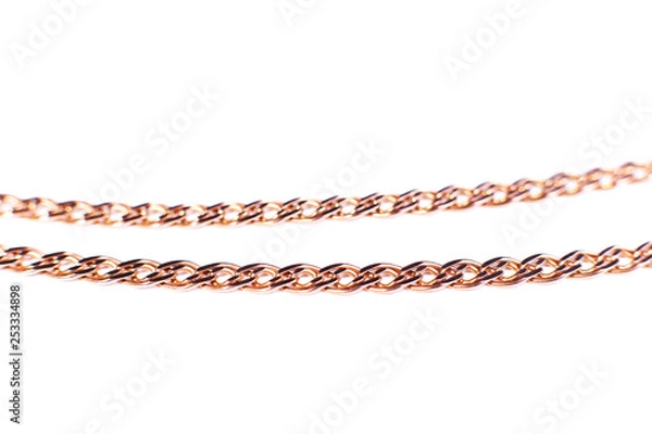 Fototapeta Golden chain weaving non, on a white background. Isolate, macro, soft focus.