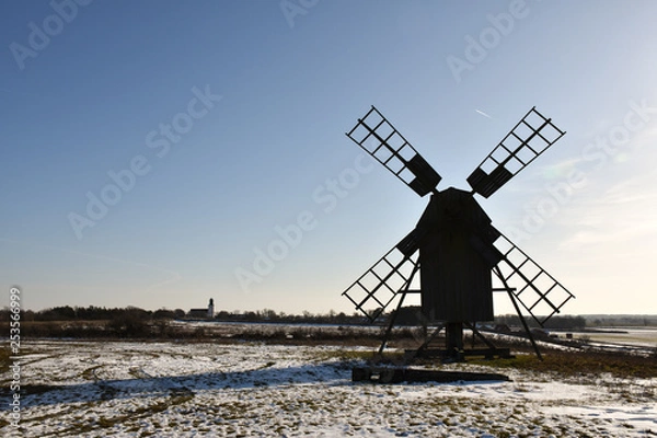 Obraz Old windmill silhouette in winter season
