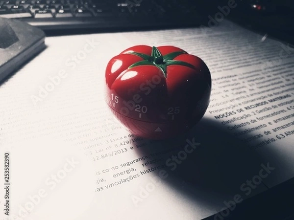 Fototapeta Pomodoro timer - mechanical tomato shaped kitchen timer for cooking or studying.