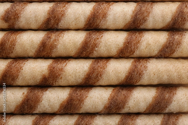 Fototapeta Tasty wafer roll sticks as background, top view. Crispy food