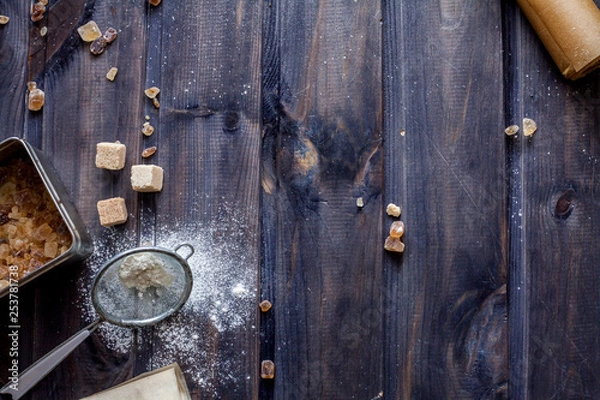 Fototapeta Cooking dough, cooking equipment, flour on a wooden table. Top view with copy space, mockup for menu, recipe. Baking background.