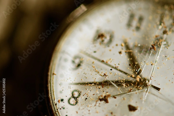 Fototapeta Broken time concept. Old dusty pocket clock with broken glass