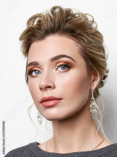 Obraz Portrait of beautiful elegant girl with blond hair, trendy styling, beautiful makeup, glossy, smooth skin posing for makeup artist social network portfolio