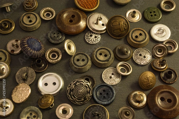 Obraz Collection of vintage clothing buttons. Dark stone background, grunge photo.