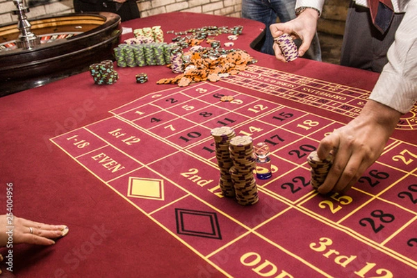 Obraz roulette accessories on red gaming table