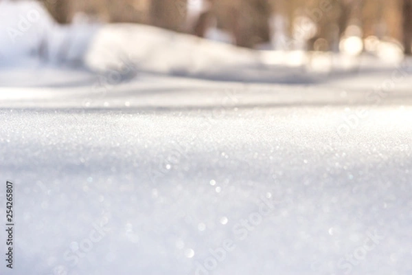 Obraz Beautiful background of snowy hill in spring sun rays with variable focus and small GRIP. Copy space, blur and soft focus.
